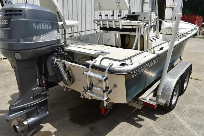 Slide: The Image of 1998 Kenner 21V CC Tunnel boat with Yamaha engine on trailer. - 11