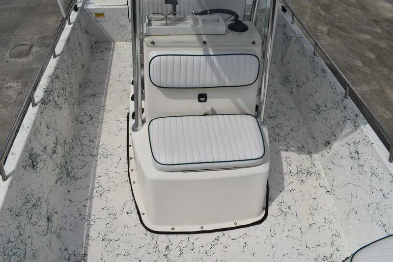 Slide: The Image of 1998 Kenner 21V CC Tunnel boat interior with white seating and console. - 19