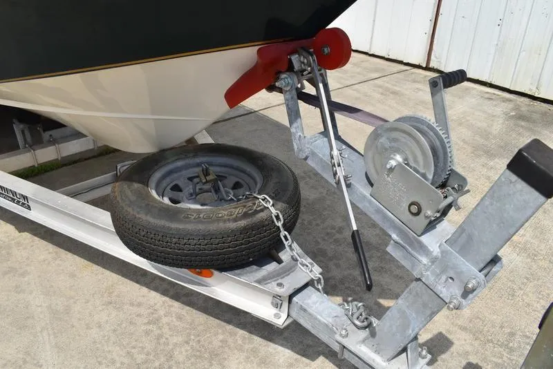 Slide: The Image of Trailer hitch with spare tire for 1998 Kenner 21V CC Tunnel boat. - 2
