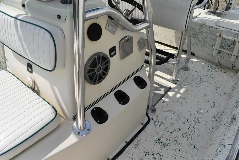 Slide: The Image of 1998 Kenner 21V CC Tunnel boat interior with console and seating details. - 22