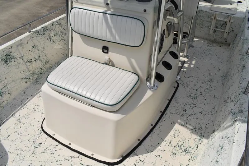 Slide: The Image of 1998 Kenner 21V CC Tunnel boat interior with white cushioned seating and marbled flooring. - 23