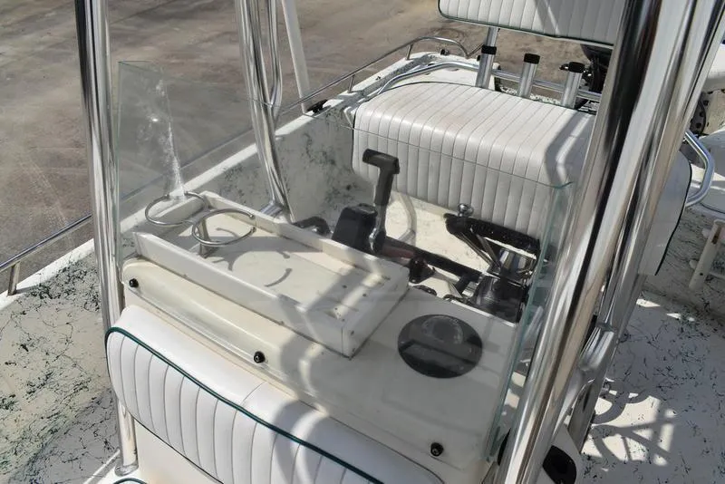 Slide: The Image of 1998 Kenner 21V CC Tunnel boat interior with steering console and seating. - 24