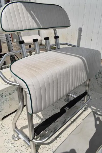 Slide: The Image of 1998 Kenner 21V CC Tunnel boat seat with white upholstery and metal frame. - 33