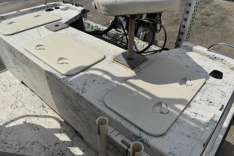 Slide: The Image of 1998 Kenner 21V CC Tunnel boat interior with storage compartments and seating. - 36