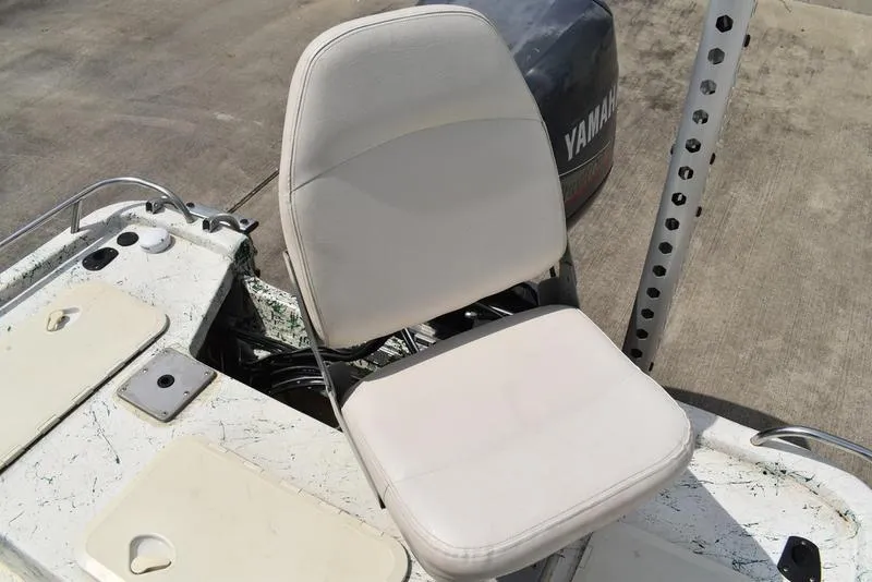 Slide: The Image of 1998 Kenner 21V CC Tunnel boat seat with Yamaha motor in background. - 37