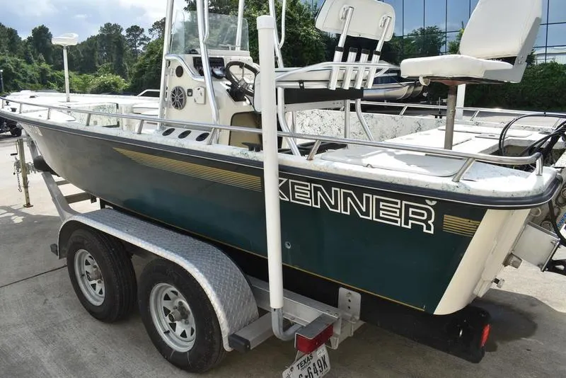 Slide: The Image of 1998 Kenner 21V CC Tunnel boat on trailer, side view, outdoors. - 4
