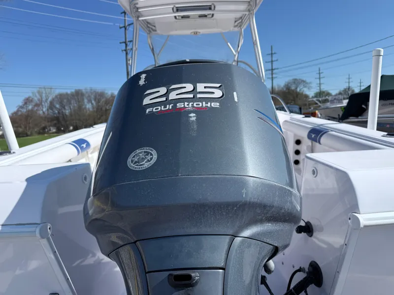 Slide: The Image of 2005 Pro-Line 23 WA boat with 225 four-stroke engine, outdoor view. - 3