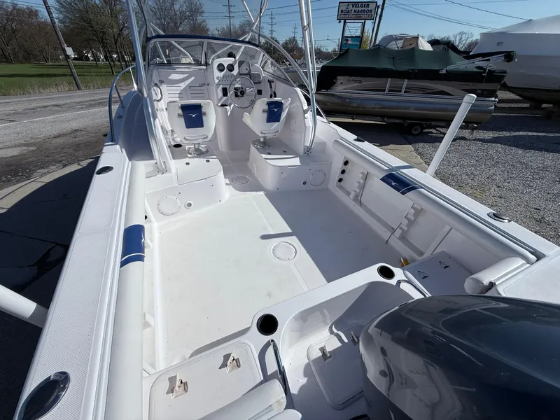 Slide: The Image of 2005 Pro-Line 23 WA boat interior with seating and control panel. - 4