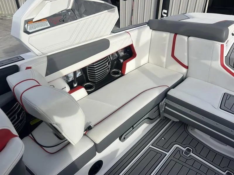 Slide: The Image of 2019 Nautique Super Air G23 interior with white and red seating, cup holders, and sleek design. - 4