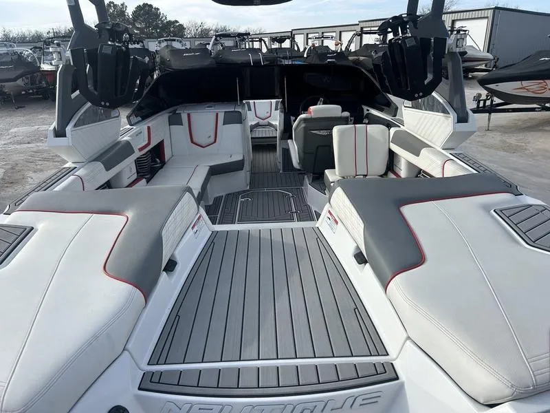 Slide: The Image of 2019 Nautique Super Air G23 boat interior with sleek seating and modern design. - 7