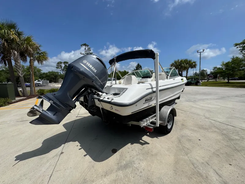 Slide: The Image of 2001 Boston Whaler 18 Ventura boat with Yamaha outboard motor on a trailer. - 12