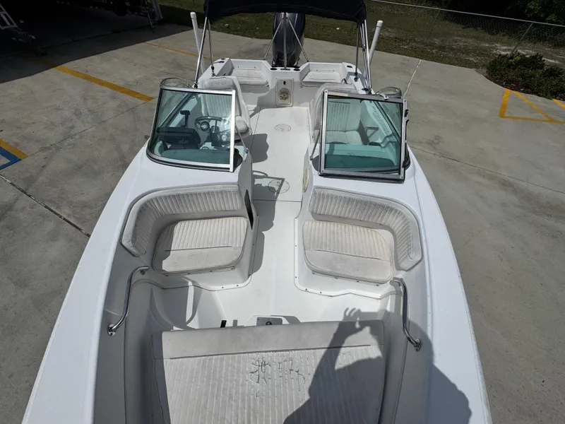 Slide: The Image of 2001 Boston Whaler 18 Ventura boat interior with seating and windshield, viewed from above. - 17