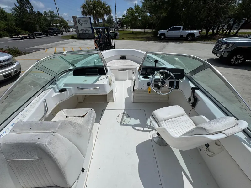 Slide: The Image of 2001 Boston Whaler 18 Ventura boat interior with seating and steering wheel. - 20