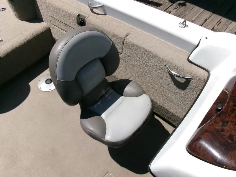 Slide: The Image of 2005 Tracker Tundra 18 DC boat seat with gray upholstery and beige interior. - 15
