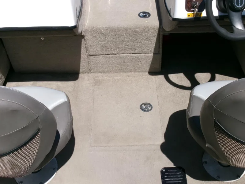 Slide: The Image of Interior of 2005 Tracker Tundra 18 DC boat with two seats and steering wheel. - 16