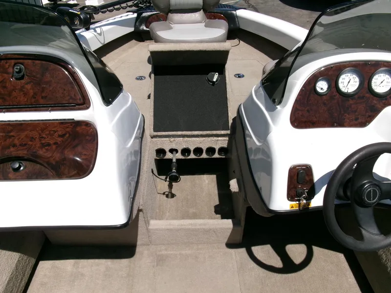 Slide: The Image of 2005 Tracker Tundra 18 DC boat interior with dual consoles and steering wheel. - 17