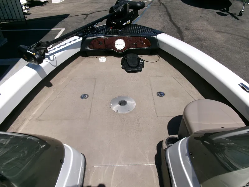 Slide: The Image of 2005 Tracker Tundra 18 DC boat deck with seating and control panel. - 6