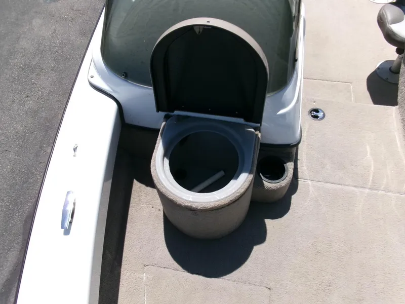 Slide: The Image of 2005 Tracker Tundra 18 DC boat interior with open storage compartment. - 8