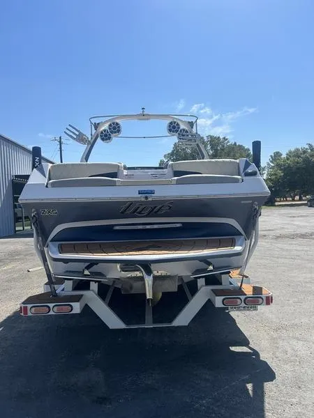 Slide: The Image of 2019 Tigé ZX5 boat on trailer, rear view, sunny day. - 6