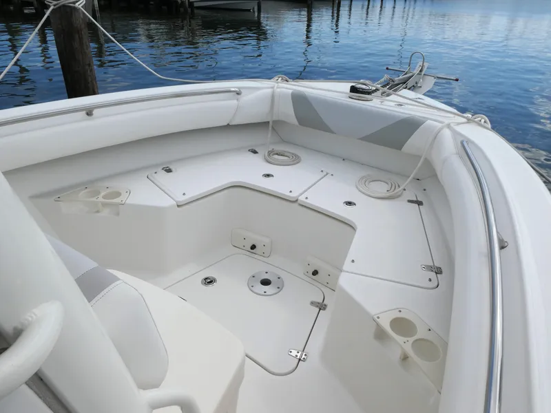 Slide: The Image of 2016 Boston Whaler 250 Outrage boat interior with seating and storage compartments. - 12