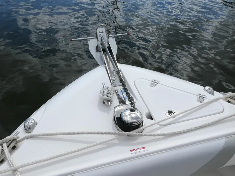 Slide: The Image of Bow of 2016 Boston Whaler 250 Outrage with anchor and ropes on water. - 13