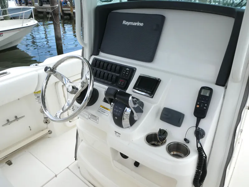 Slide: The Image of Control panel of a 2016 Boston Whaler 250 Outrage boat with Raymarine electronics. - 14