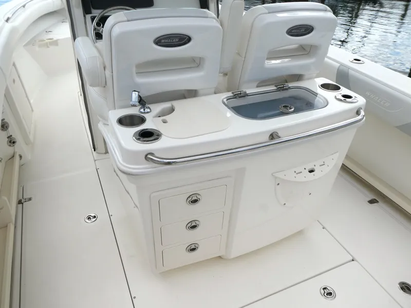 Slide: The Image of 2016 Boston Whaler 250 Outrage boat interior with seating and storage compartments. - 7
