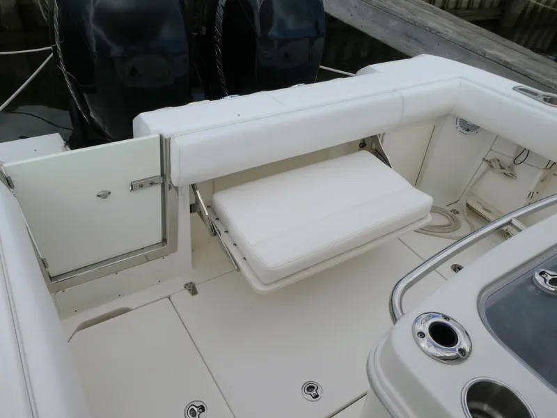 Slide: The Image of 2016 Boston Whaler 250 Outrage boat interior with seating and storage compartments. - 8