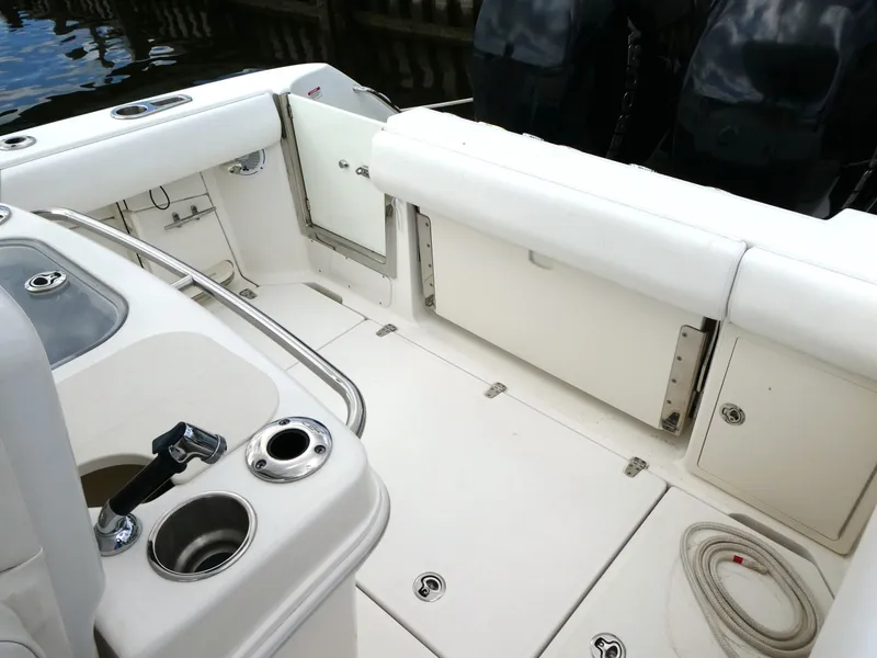 Slide: The Image of 2016 Boston Whaler 250 Outrage boat interior with seating and storage compartments. - 9