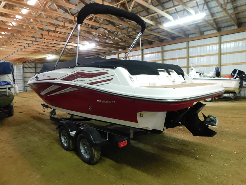 Slide: The Image of 2020 Bayliner VR 6 boat in a storage facility, featuring a red and white design. - 4