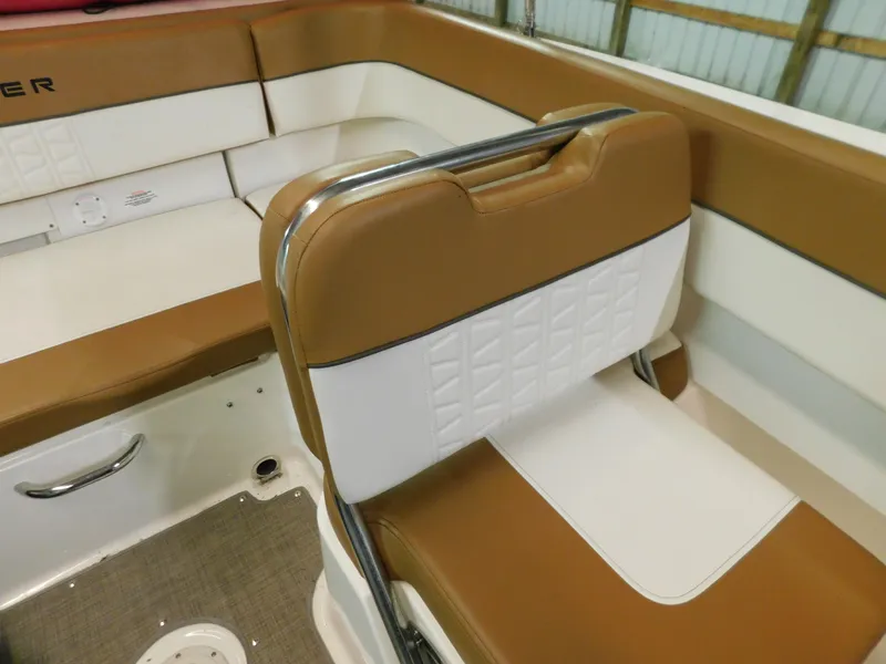Slide: The Image of 2020 Bayliner VR 6 boat interior with tan and white seating, featuring modern design and comfort. - 8