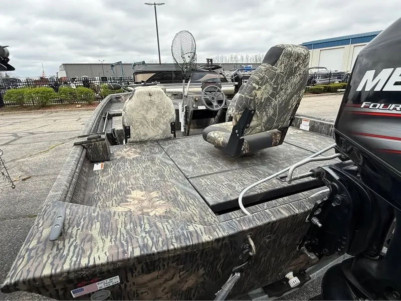 Slide: The Image of 2018 Lowe Roughneck 1760SC boat with camouflage seats and Mercury outboard motor. - 2