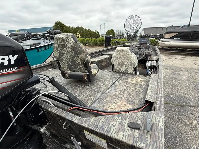 Slide: The Image of 2018 Lowe Roughneck 1760SC boat with camouflage seats and Mercury outboard motor. - 3