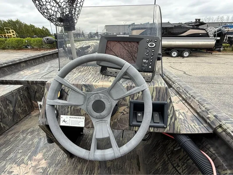 Slide: The Image of Steering console of 2018 Lowe Roughneck 1760SC boat with navigation equipment. - 6