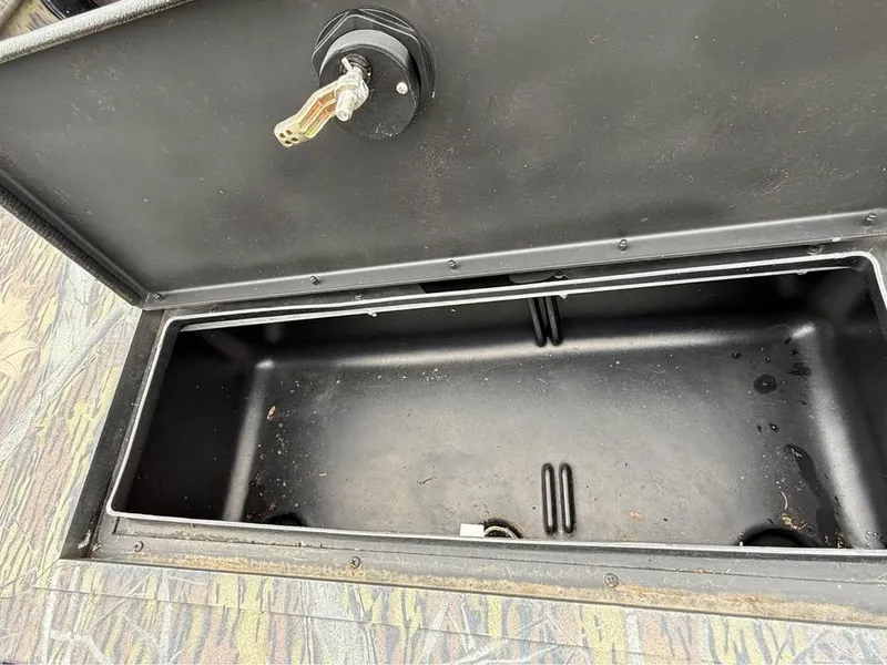 Slide: The Image of Open storage compartment in 2018 Lowe Roughneck 1760SC boat. - 8