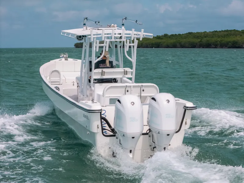 Slide: The Image of 2022 Panga Eduardoño Corvina boat cruising on open water with twin engines. - 1