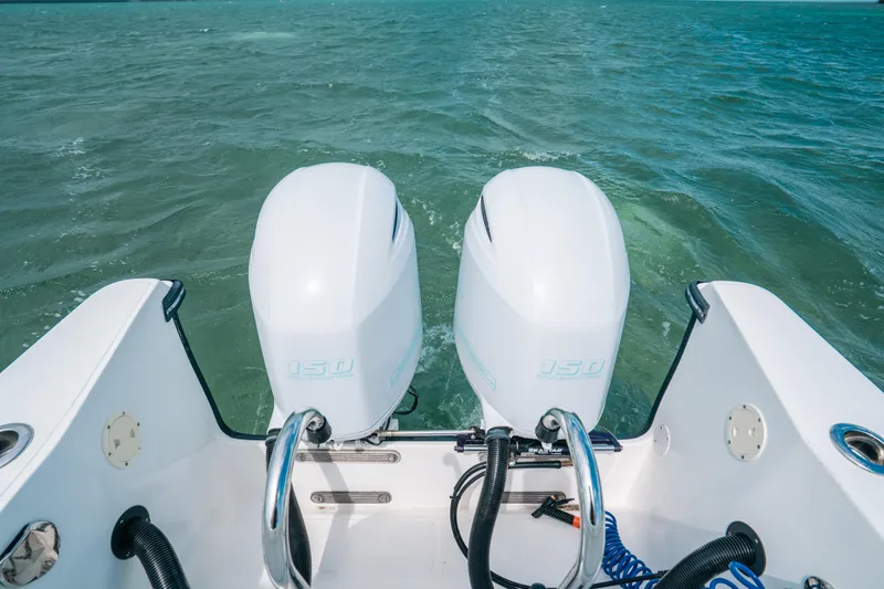 Slide: The Image of Twin outboard motors on 2022 Panga Eduardoño Corvina boat in open water. - 22