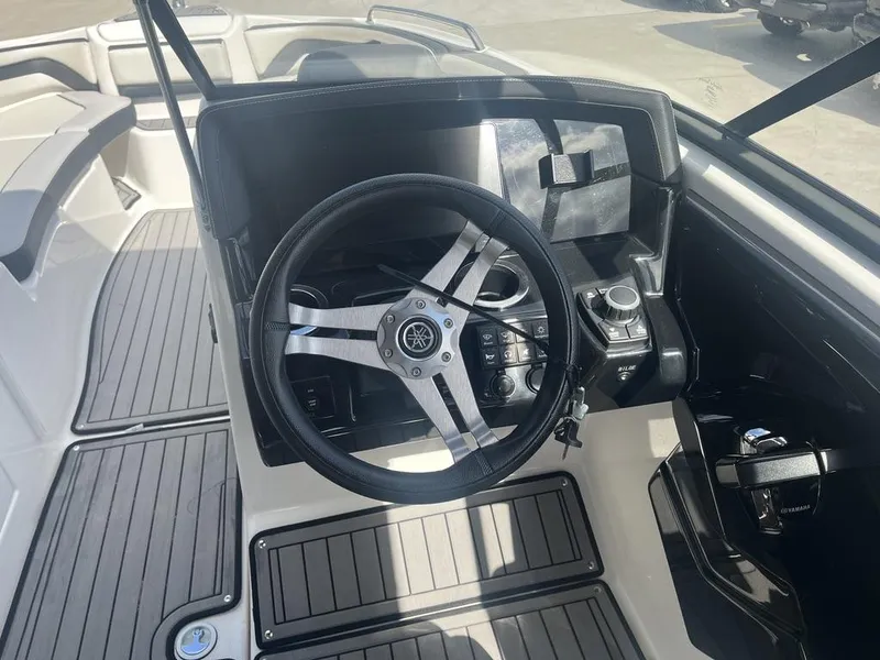 Slide: The Image of 2018 Yamaha Boats 242 Limited S E-Series dashboard with steering wheel and controls. - 11