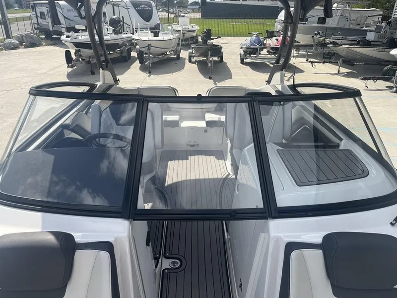 Slide: The Image of 2018 Yamaha Boats 242 Limited S E-Series interior view at a marina. - 15