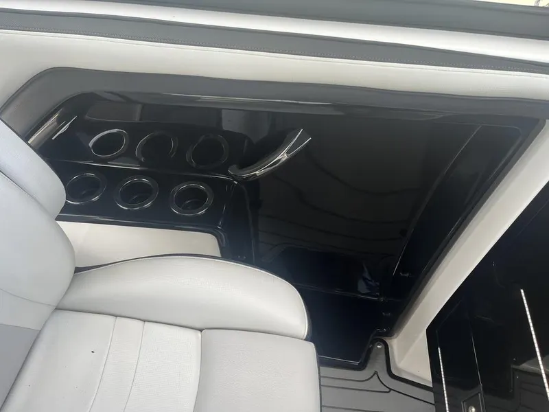 Slide: The Image of Interior of 2018 Yamaha Boats 242 Limited S E-Series with cup holders and seating. - 16