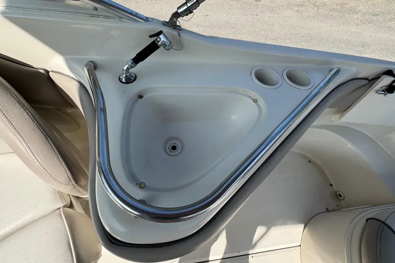 Slide: The Image of 2003 Sea Ray 240 Sundeck sink and cup holders on deck. - 4