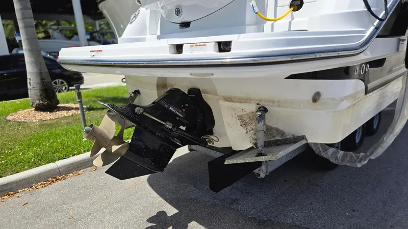 Slide: The Image of Rear view of a 2022 Monterey 295SY boat showing the propeller and stern drive. - 2