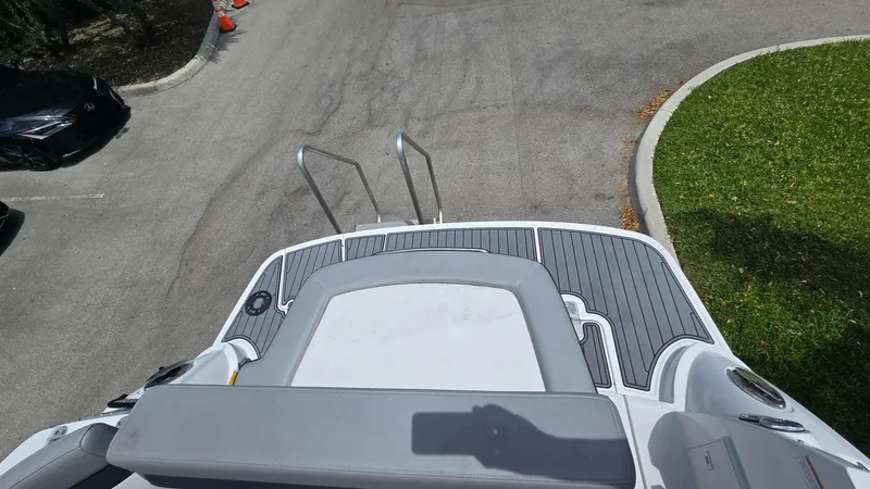 Slide: The Image of 2022 Monterey 295SY boat stern view with swim platform and ladder. - 5