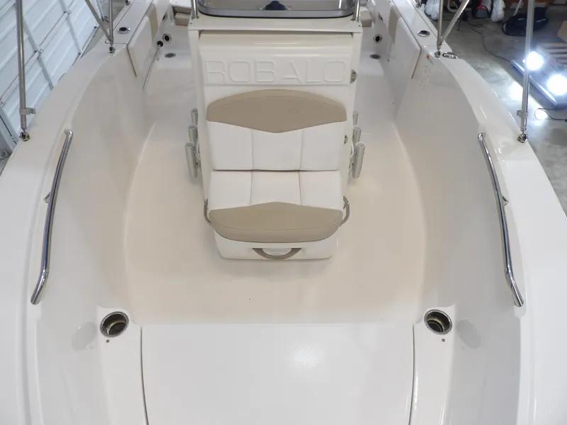 Slide: The Image of 2020 Robalo R180 boat interior with cushioned seating and stainless steel railings. - 10