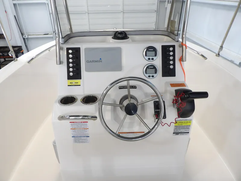 Slide: The Image of 2020 Robalo R180 boat console with Garmin navigation and Yamaha gauges. - 14