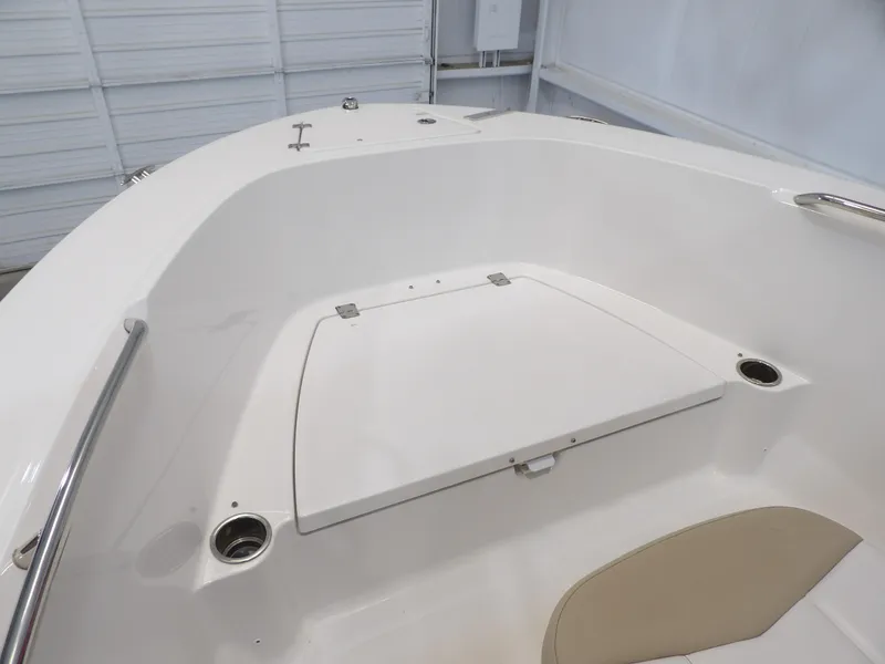 Slide: The Image of 2020 Robalo R180 boat interior with storage compartment and cup holders. - 9