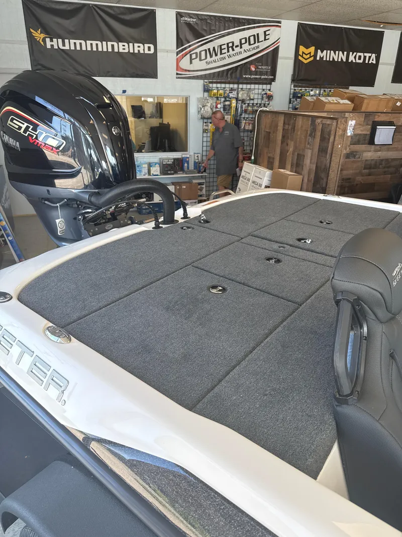 Slide: The Image of 2025 Skeeter ZXR20SE boat interior with Yamaha engine, displayed in a showroom. - 11
