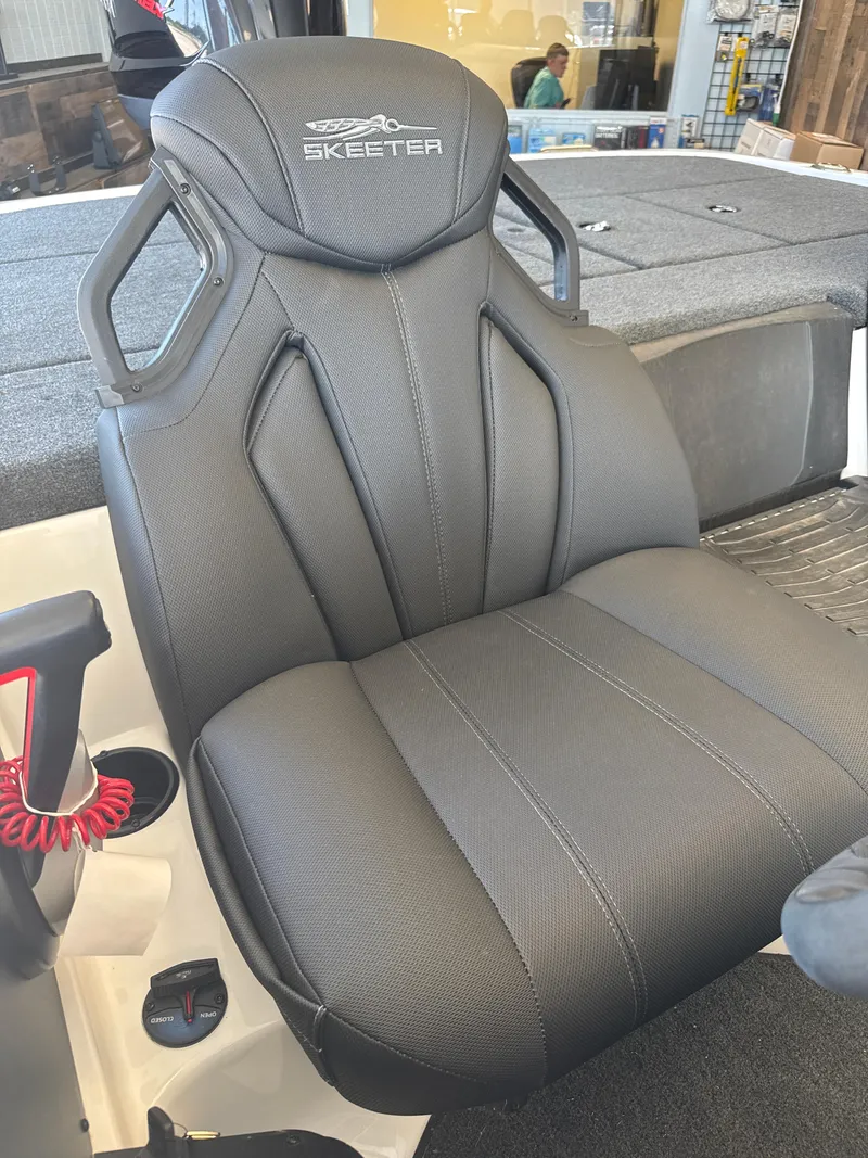 Slide: The Image of 2025 Skeeter ZXR20SE boat seat with ergonomic design and sleek black upholstery. - 13