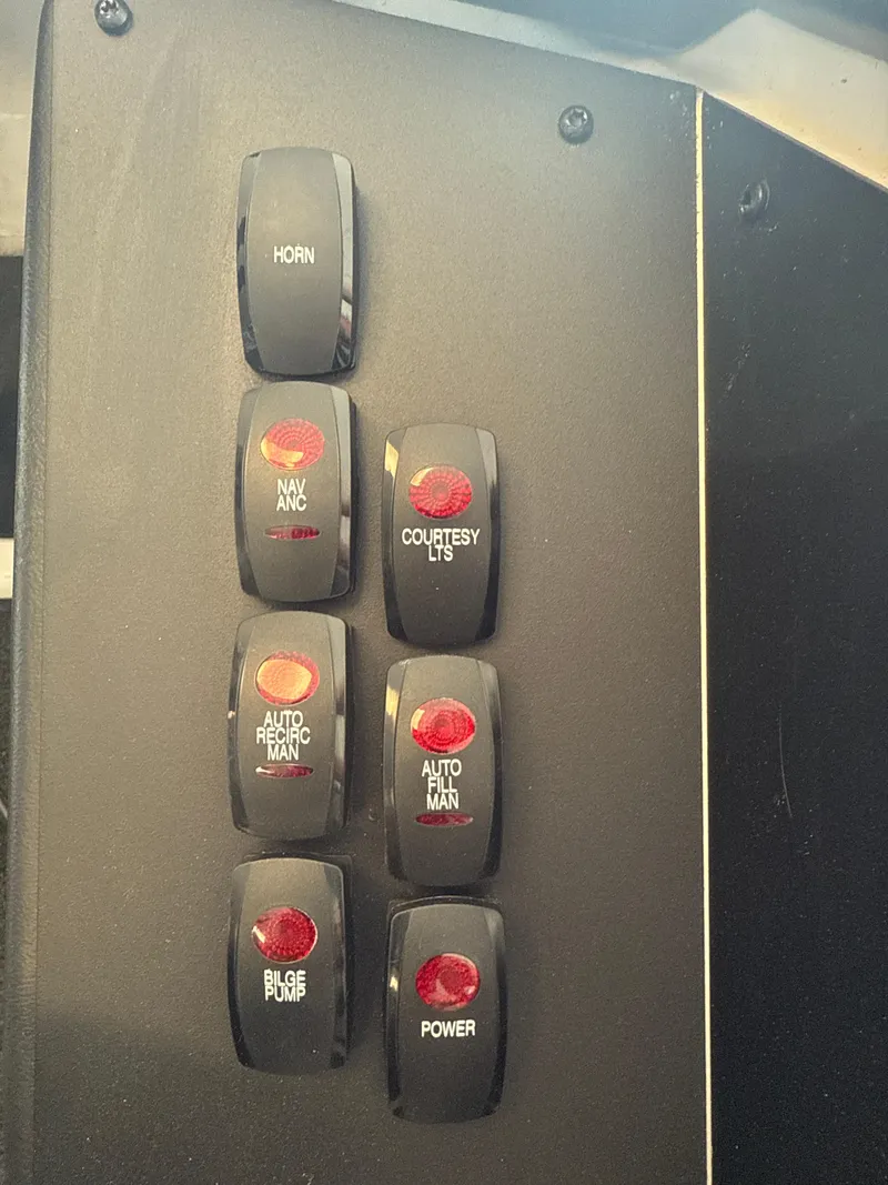 Slide: The Image of Control panel of a 2025 Skeeter ZXR20SE boat with labeled switches. - 14