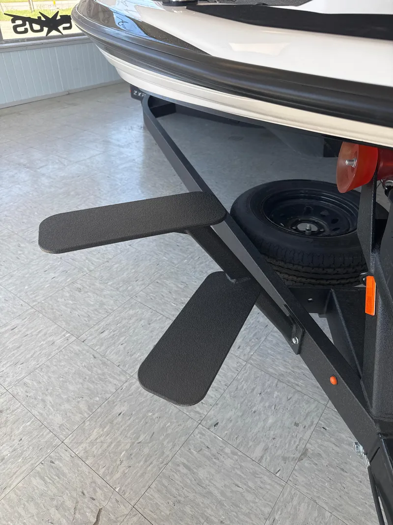 Slide: The Image of 2025 Skeeter ZXR20SE boat trailer with spare tire and step pads. - 16